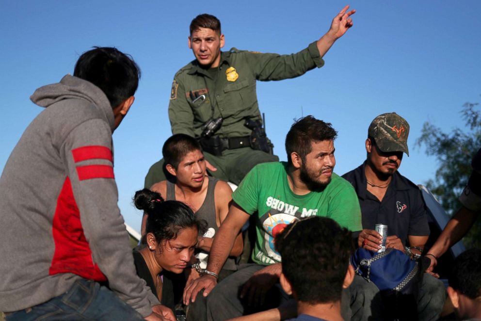 PHOTO: Men and a woman are transported in the back of a truck after they were apprehended by the Border Patrol in Falfurrias, Texas for illegally crossing into the U.S. border from Mexico, Aug. 30, 2018.