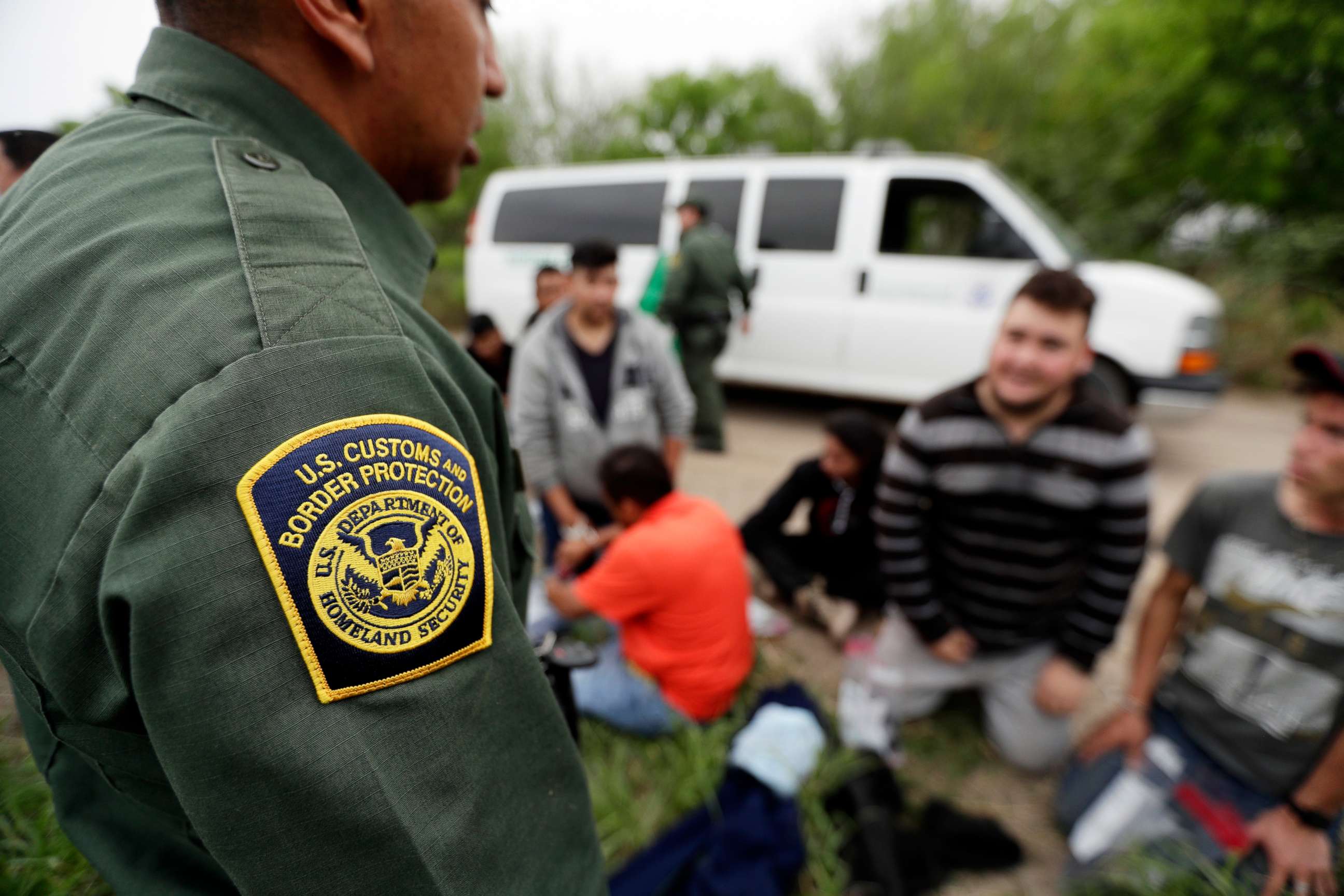 PHOTO: A Border Patrol agent talks with a group suspected of having entered the U.S. illegally near McAllen, Texas, March 14, 2019.