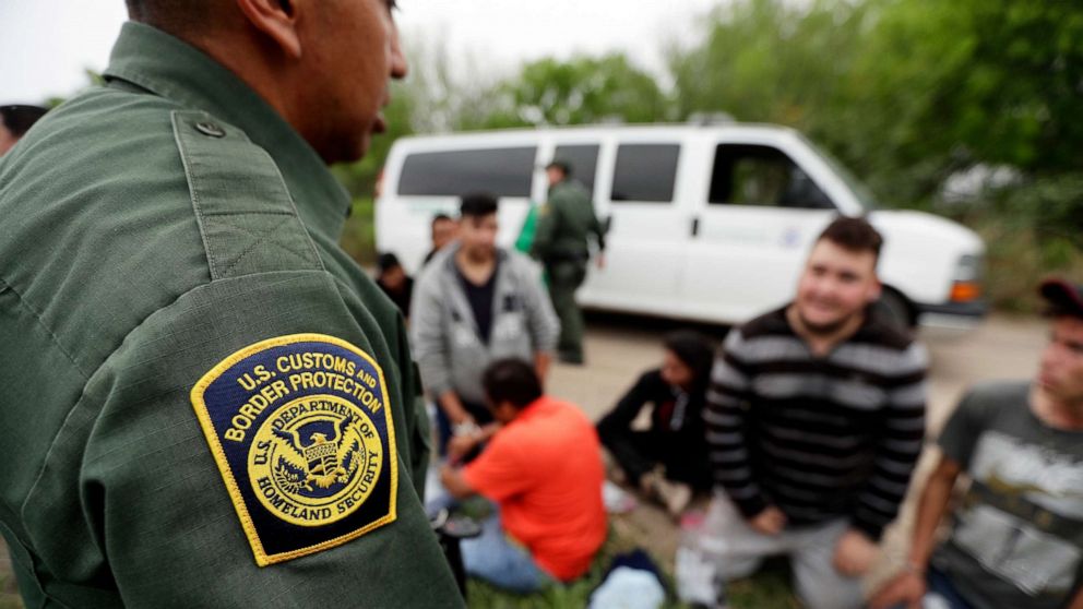 PHOTO: A Border Patrol agent talks with a group suspected of having entered the U.S. illegally near McAllen, Texas, March 14, 2019.