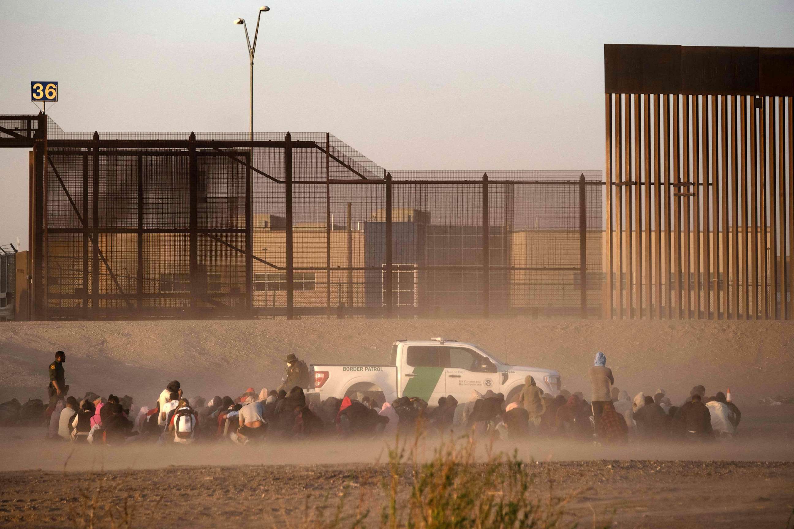 PHOTO: Migrants wait to be processed by United States Border Patrol seen from Ciudad Juarez, Chihuahua state, Mexico, on March 30, 2023.