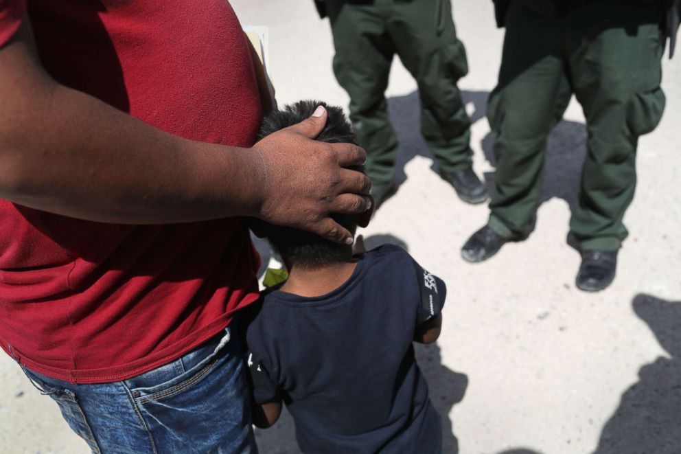 PHOTO: U.S. Border Patrol agents take a father and son from Honduras into custody near the U.S.-Mexico border, June 12, 2018, near Mission, Texas.