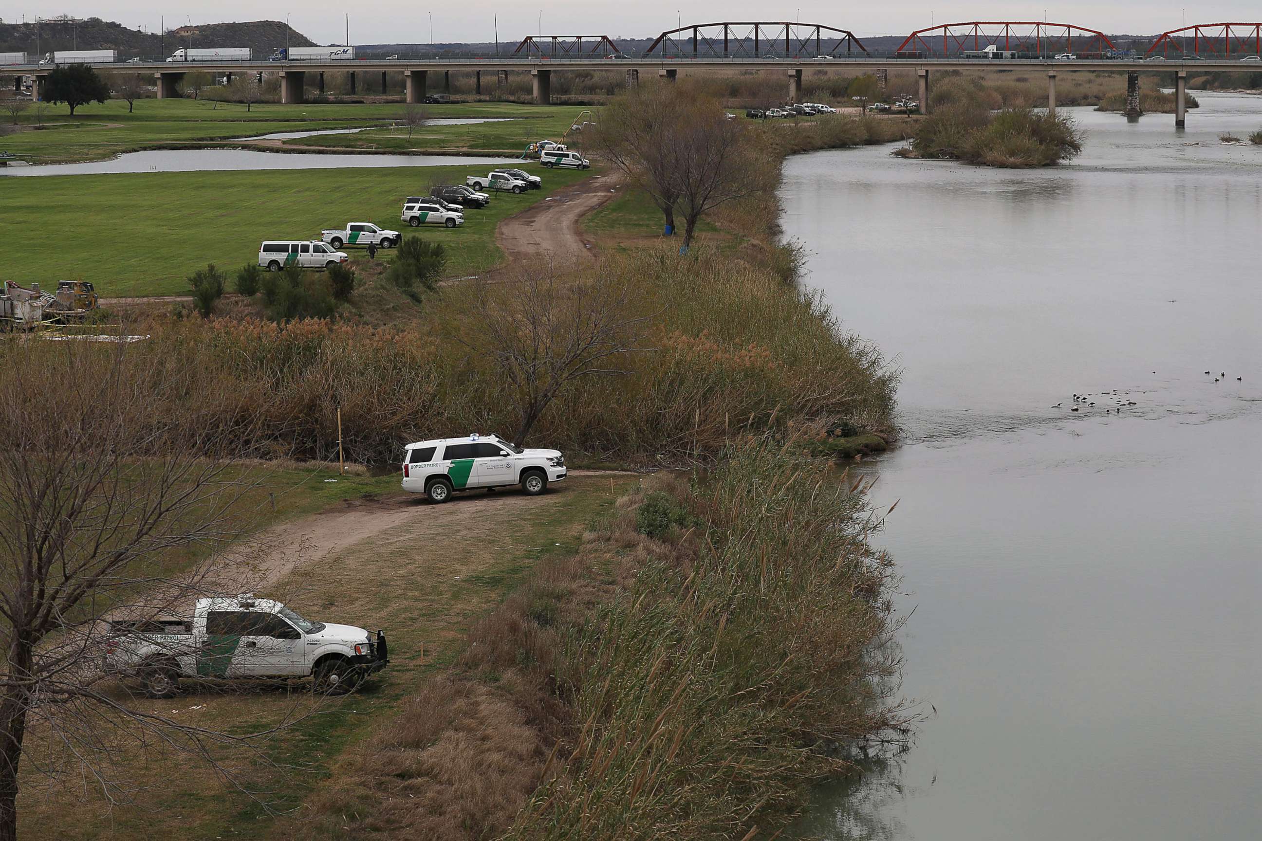 PHOTO: Law Enforcement and Border Patrol vehicles are seen as they line the banks of the Rio Grande at the U.S.-Mexico border on Feb. 08, 2019, in Piedras Negras, Texas.