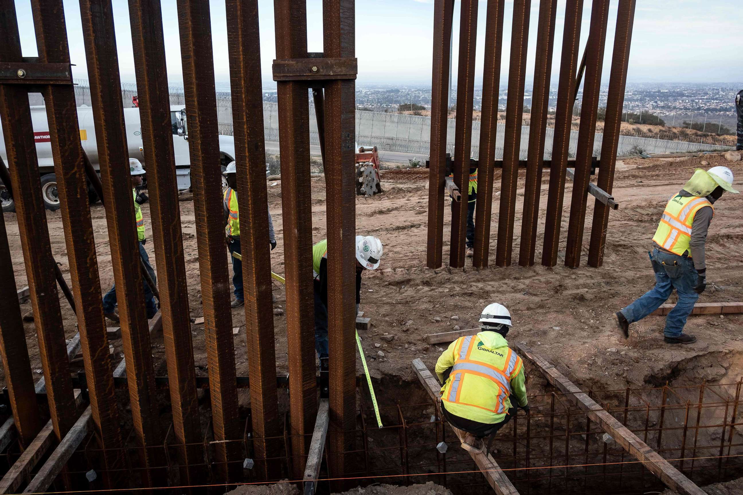 PHOTO: A construction crew works on replacing the U.S.-Mexico border fence near Tijuana, Mexico, Jan. 9, 2019.