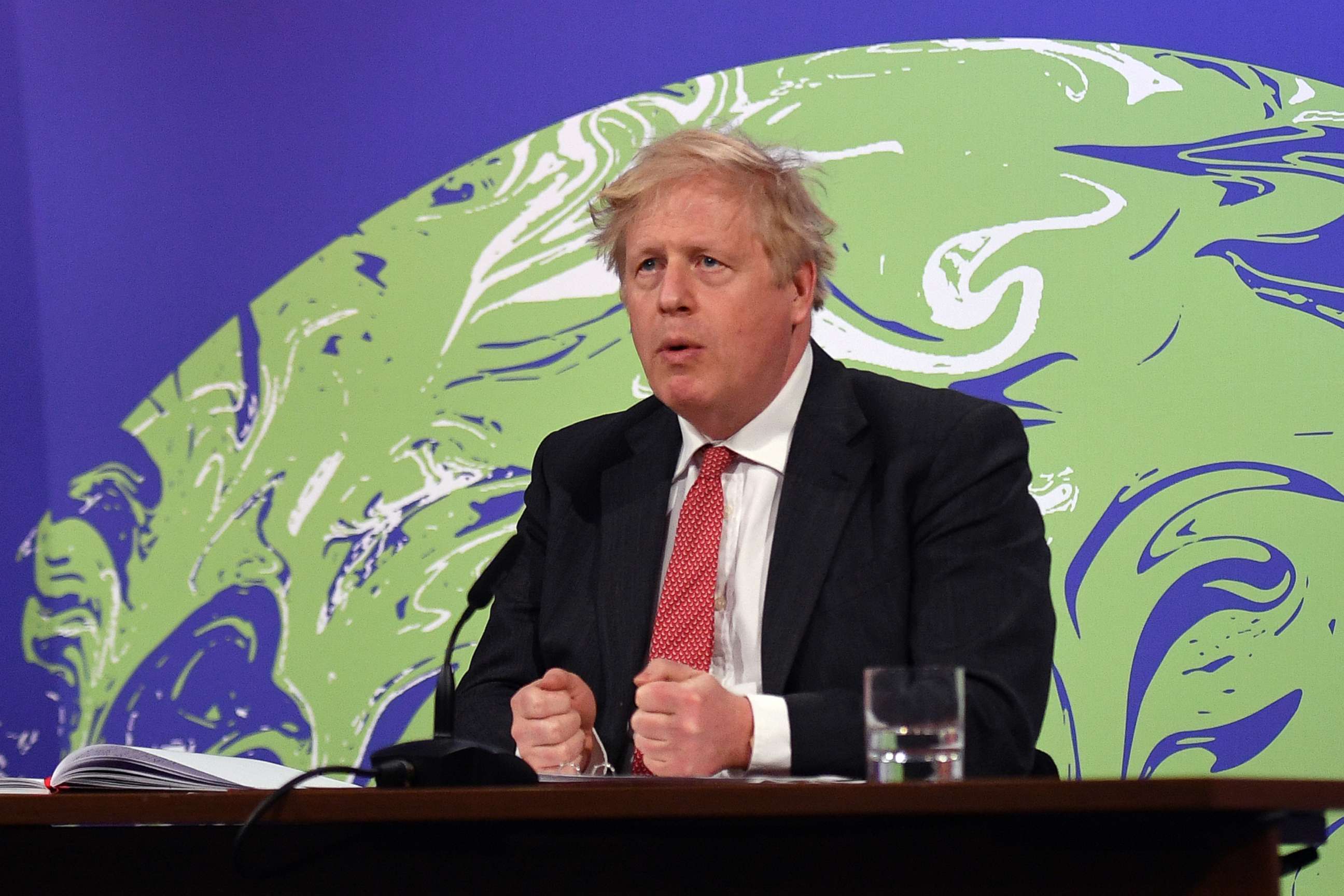 PHOTO: Britain's Prime Minister Boris Johnson speaks during the opening session of the virtual U.S Leaders Summit on Climate from the Downing Street Briefing Room on April 22, 2021 in London.