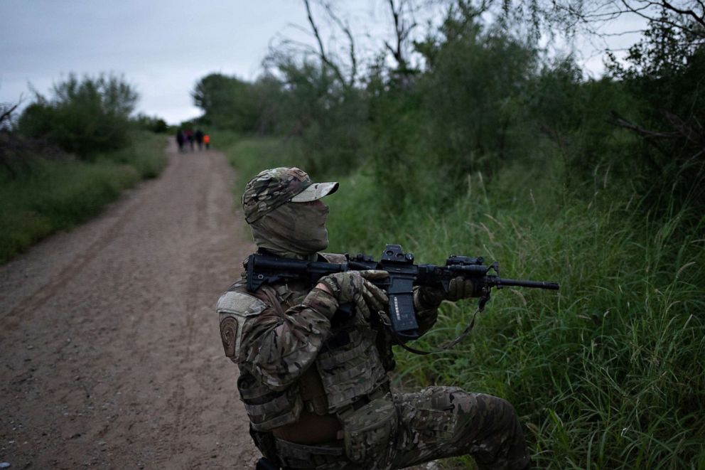 PHOTO: A member of the U.S. Border Patrol Tactical Unit, known as BORTAC, lifts his weapon in response to sounds of gunshots near where a family illegally crossed the Rio Grande river into the United States from Mexico, in Fronton, Texas, Oct. 18, 2018.