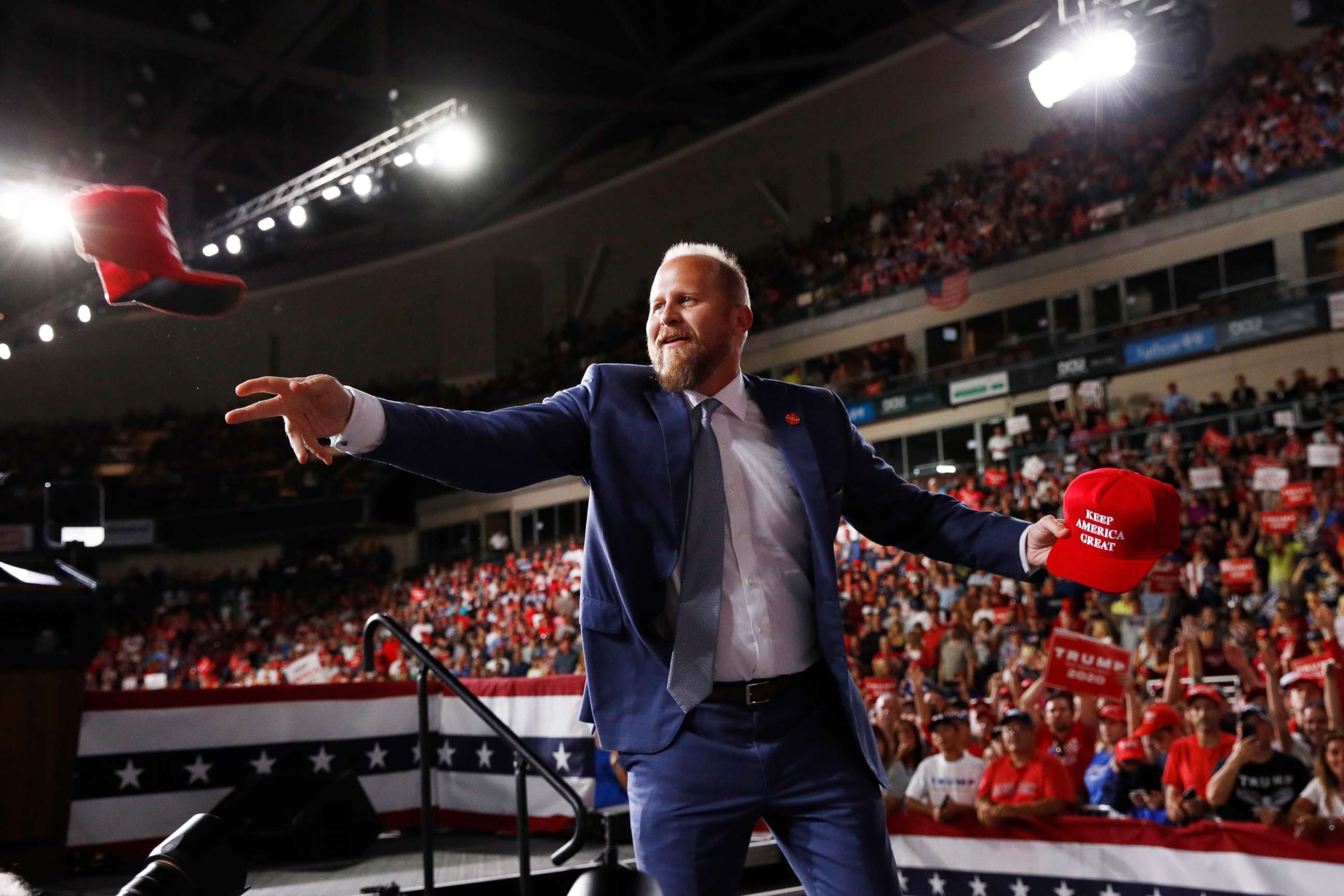 PHOTO: President Donald Trump's Campaign Manager Brad Parscale, tosses out hats to supporters before President Donald Trump speaks at a campaign rally, Thursday, Aug. 15, 2019, in Manchester, N.H.