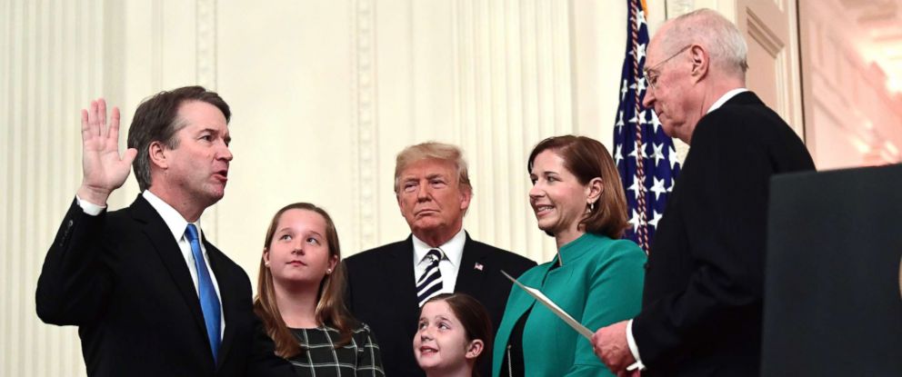 PHOTO: Retired Justice Anthony Kennedy, right, ceremonially swears-in Supreme Court Justice Brett Kavanaugh, as President Donald Trump looks on, in the East Room of the White House, Oct. 8, 2018.