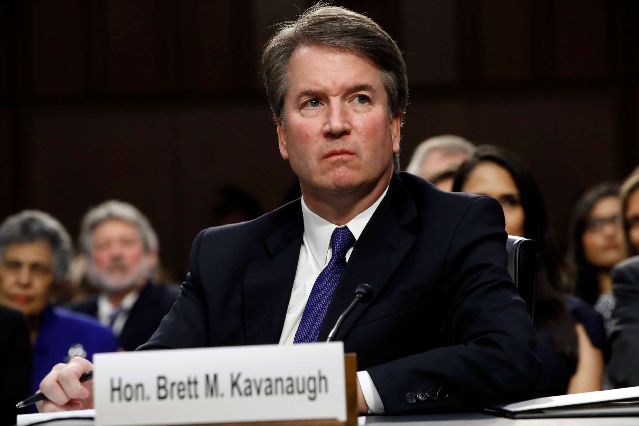 PHOTO: Supreme Court nominee Brett Kavanaugh listens as a protester yells during his confirmation hearing with the Senate Judiciary Committee on Capitol Hill, Sept. 4, 2018.