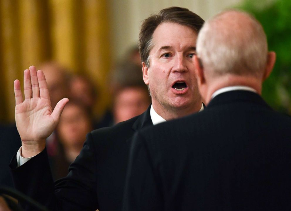 PHOTO: Brett Kavanaugh (L) is sworn-in as Associate Justice of the US Supreme Court by retired Associate Justice Anthony Kennedy at the White House, Oct. 8, 2018.