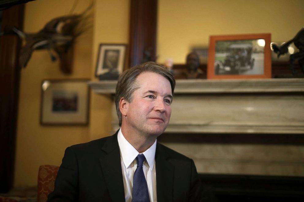 PHOTO: Judge Brett Kavanaugh listens to Sen. Rob Portman talk about Kavanaugh's qualifications before a meeting in the Russell Senate Office Building on Capitol Hill July 11, 2018 in Washington.