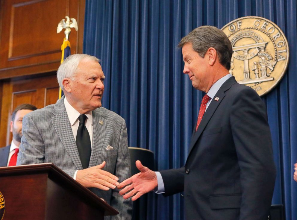 PHOTO: Republican Brian Kemp, right, shakes hands with Georgia Gov. Nathan Deal at the Capitol, Nov. 8, 2018, in Atlanta, Ga.