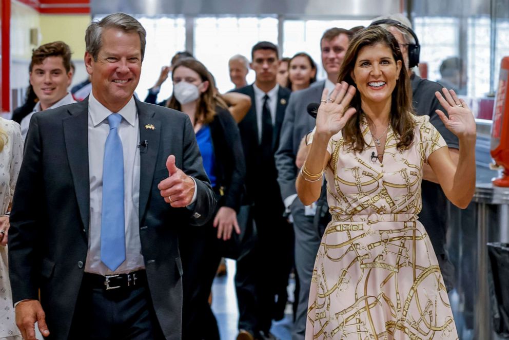 PHOTO: Former U.S. Ambassador Nikki Haley reacts with Georgia Governor Brian Kemp during a campaign stop at The Varsity restaurant in Atlanta, Sept. 9, 2022.