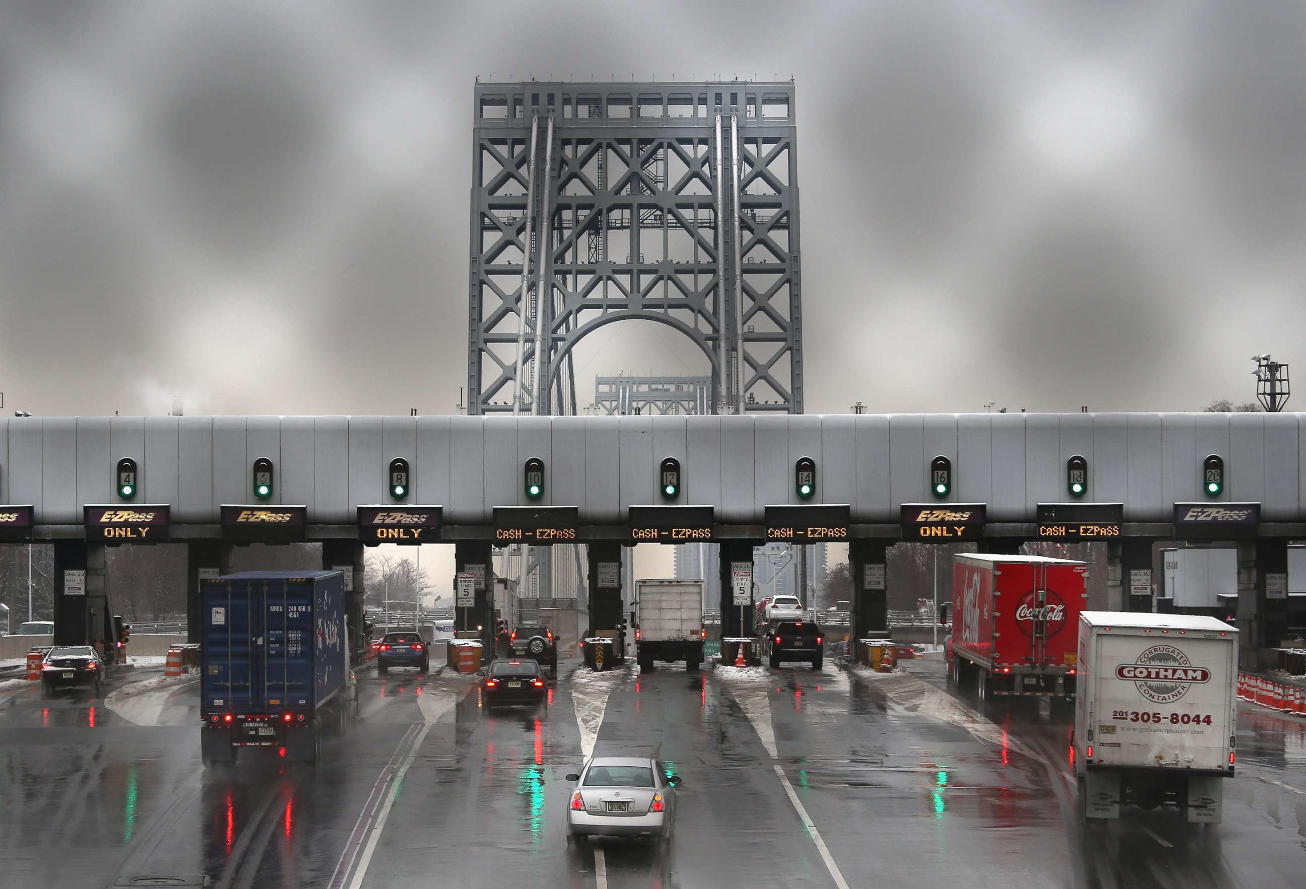 PHOTO: In this Dec. 17, 2013 file photo, vehicles slow for tolls before crossing the George Washington Bridge in Ft. Lee, New Jersey. 
