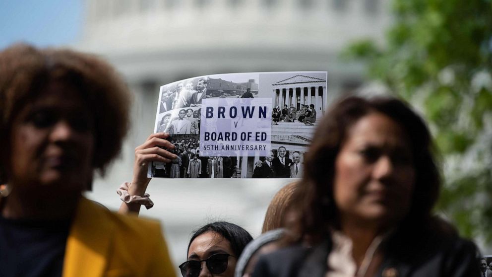 PHOTO: People attend a rally to mark the 65th anniversary of the US Supreme Court's Brown v Board of Education ruling that ended segregation in public schools, near the Capitol in Washington, DC, May 16, 2019.
