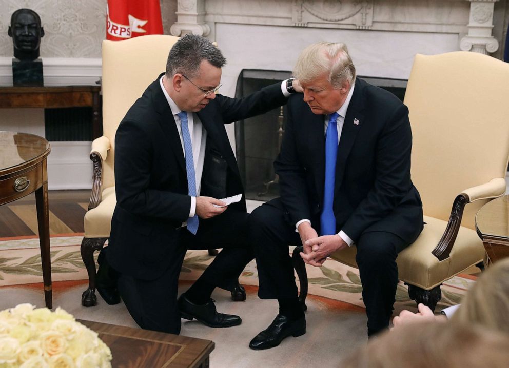 PHOTO: President Donald Trump and American evangelical Christian preacher Andrew Brunson pray in the Oval Office a day after Brunson was released from a Turkish jail, Oct. 13, 2018.
