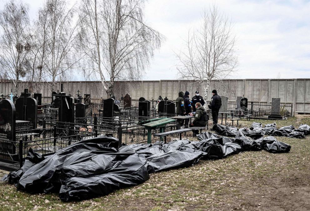 PHOTO: Body bags are lined up for identification by forensic personnel and police officers in the cemetery in Bucha, north of Kyiv, Ukraine, on April 6, 2022.