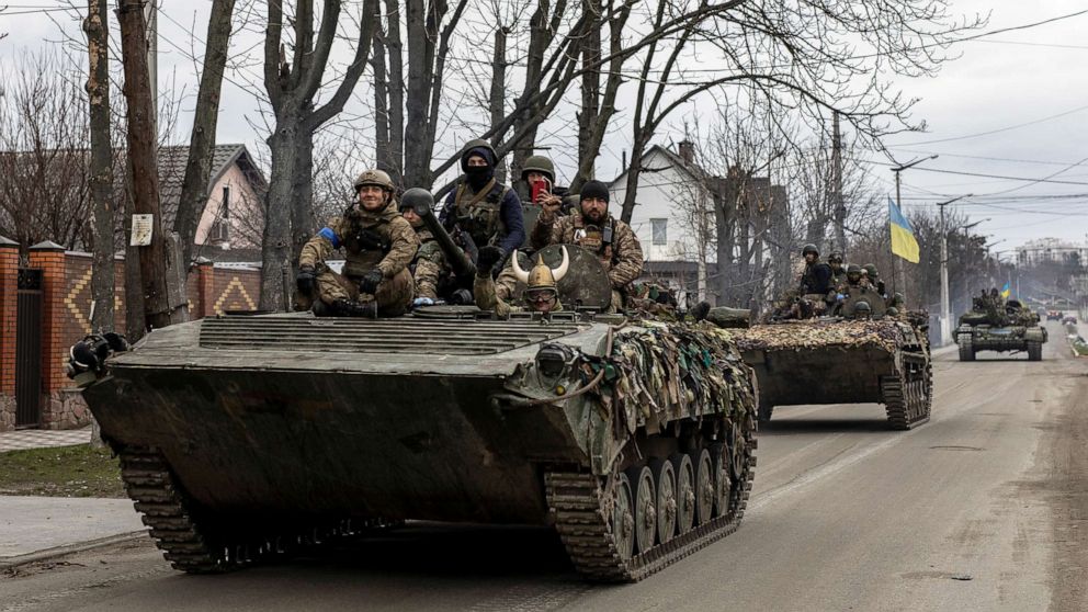 PHOTO: Ukrainian soldiers are seen on tanks, amid Russia's invasion of Ukraine, in Bucha, Kyiv region, Ukraine, April 6, 2022.