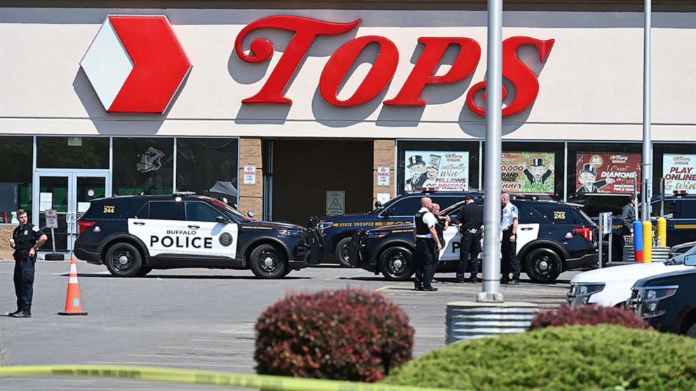 PHOTO: Police sit in front of a Tops Grocery store in Buffalo, N.Y., on May 15, 2022, after a white gunman fatally shot 10 people at a grocery store in a racially-motivated rampage, on May 14, 2022.