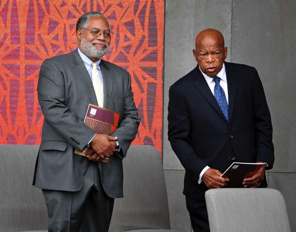 PHOTO: Lonnie Bunch, left, director of the Smithsonian Museum of African American History and Culture, left, and Rep. John Lewis, D-Ga. take their seats for the dedication ceremony of the Smithsonian Museum of African American History and Culture.