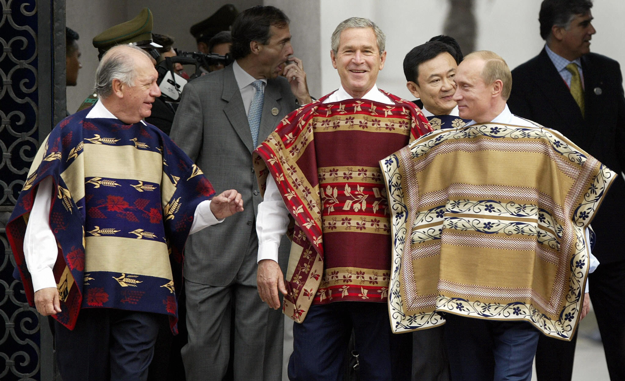 PHOTO: President George W. Bush wears a traditional Chilean poncho with Chilean President Ricardo Lagos, left, and Russian President Vladimir Putin at the La Moneda Presidential Palace during the APEC Summit Nov. 21, 2004 in Santiago, Chile. 