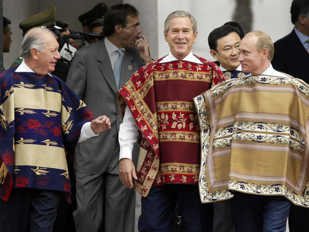 PHOTO: President George W. Bush wears a traditional Chilean poncho with Chilean President Ricardo Lagos, left, and Russian President Vladimir Putin at the La Moneda Presidential Palace during the APEC Summit Nov. 21, 2004 in Santiago, Chile.