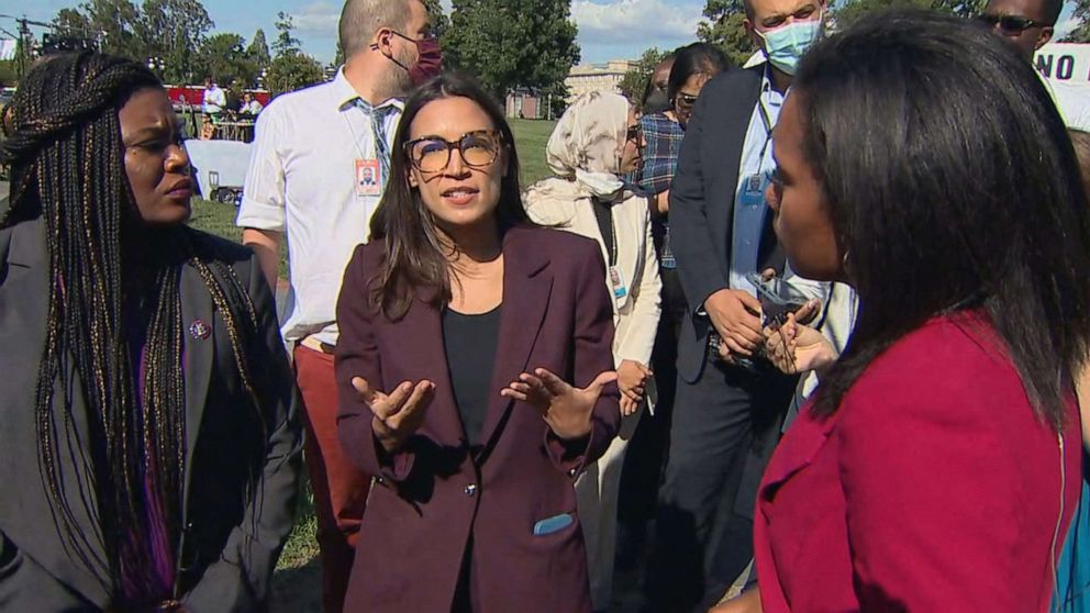 PHOTO: Reps. Alexandria Ocasio-Cortez and Cori Bush, left, talk about Sen. Joe Manchin demanding that Democrats trim the size and scale of their social spending proposal to win his support, Sept. 30, 2021, outside the U.S. Capitol.