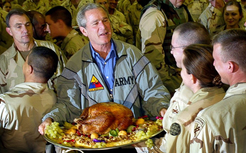 PHOTO: President George W. Bush holds a Thanksgiving turkey for U.S. troops stationed at Baghdad International Airport on Nov. 27, 2003 in Baghdad, Iraq.