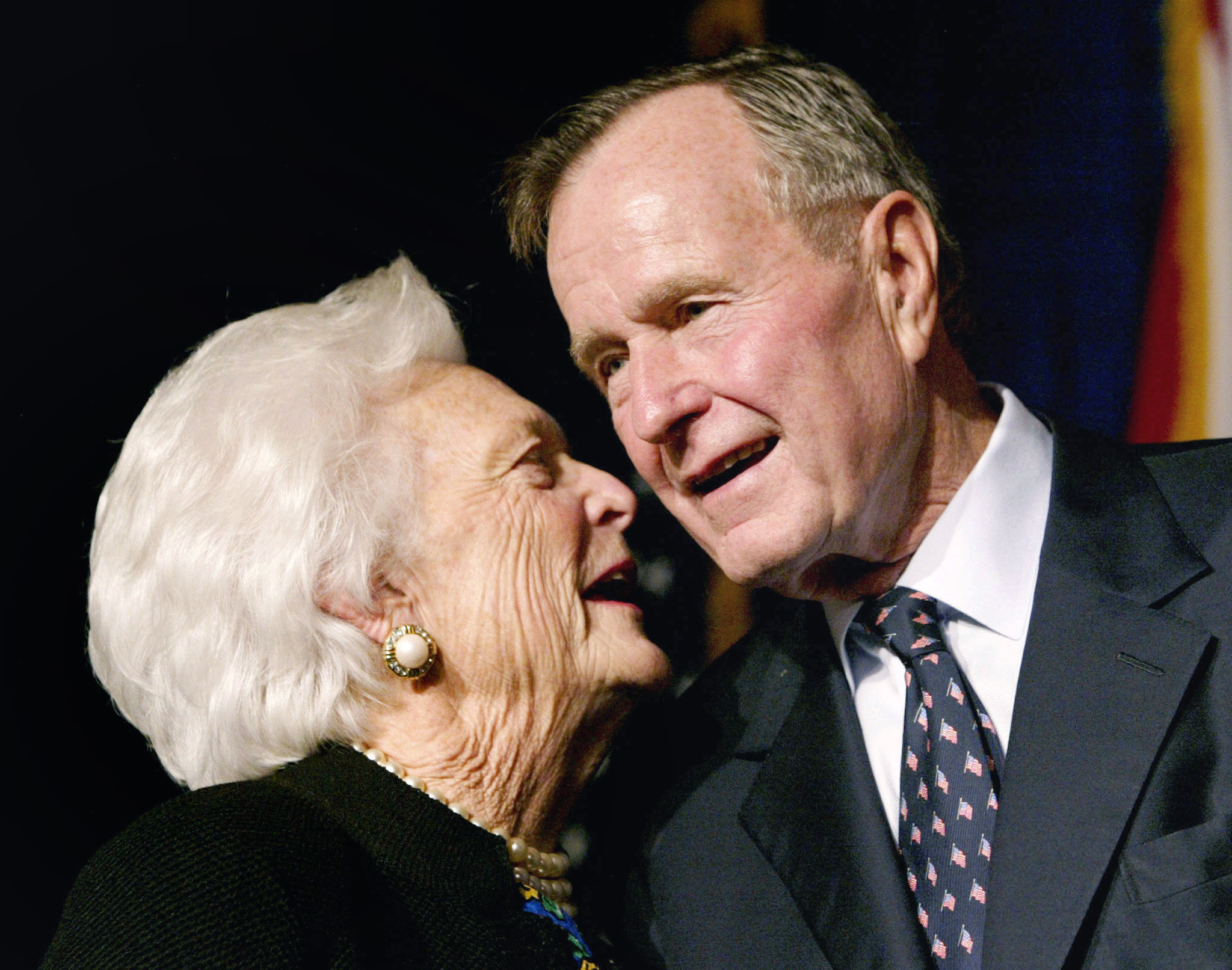 PHOTO: Former U.S. President George Bush speaks with his wife Barbara as their son, Florida Republican gubernatorial candidate, incumbent Gov. Jeb Bush, celebrates victory at his election night party in Miami, Nov. 5, 2002.