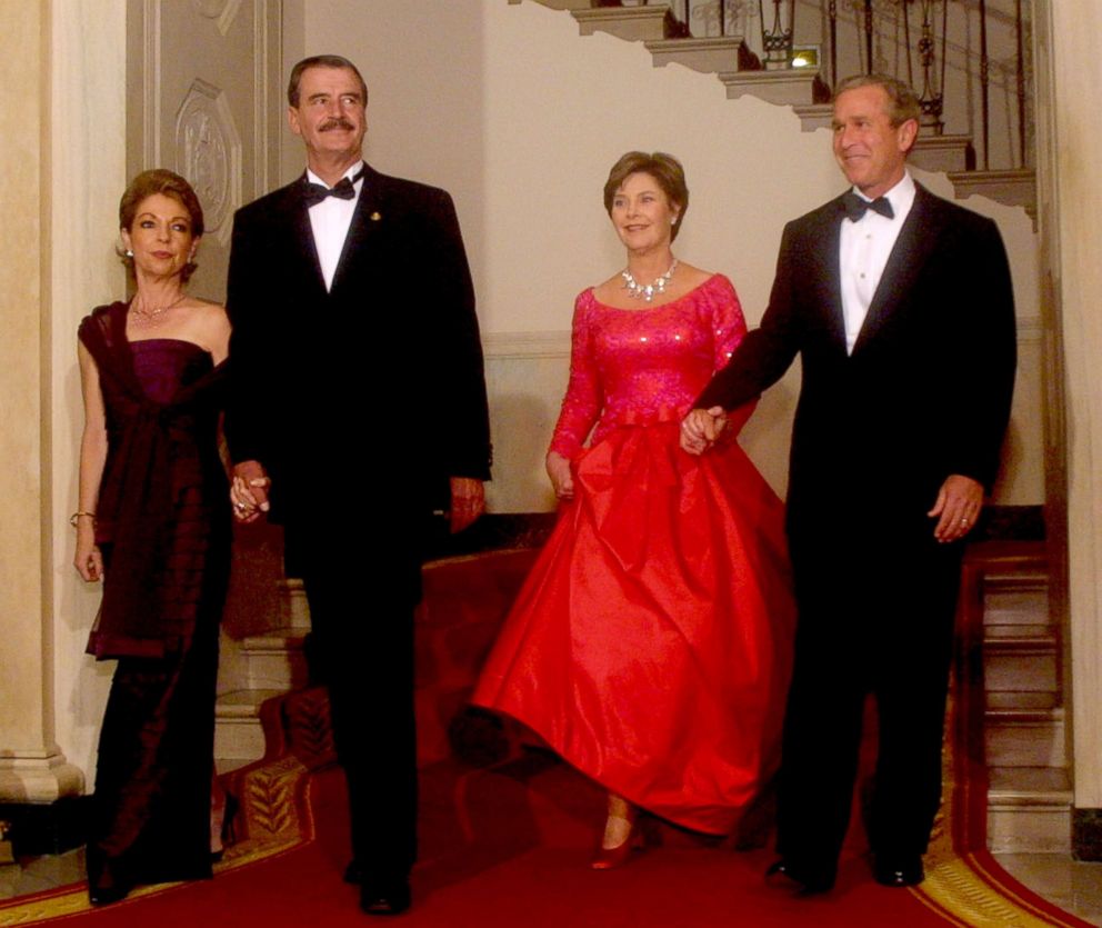 President George W. Bush, first lady Laura Bush, Mexican President Vicente Fox and his wife Martha Fox arrive at a state dinner for the Mexican president Sept. 5, 2001 at the White House in Washington. 