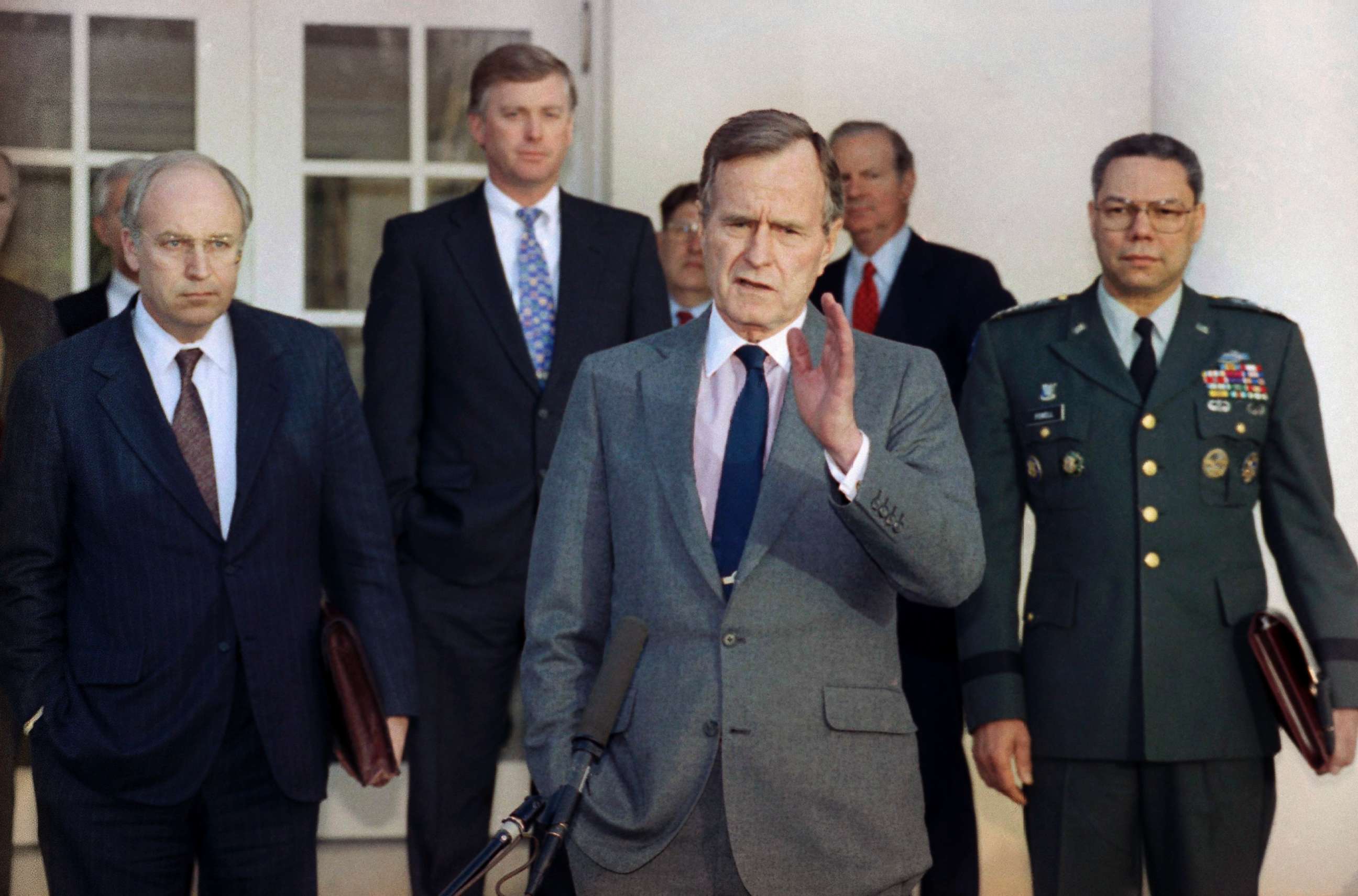 PHOTO: President George H.W. Bush talks to reporters in the Rose Garden of the White House after a meeting to discuss the Persian Gulf War. From left, Dick Cheney, Dan Quayle, John Sununu, the president, James A. Baker III, and Gen. Colin Powell.