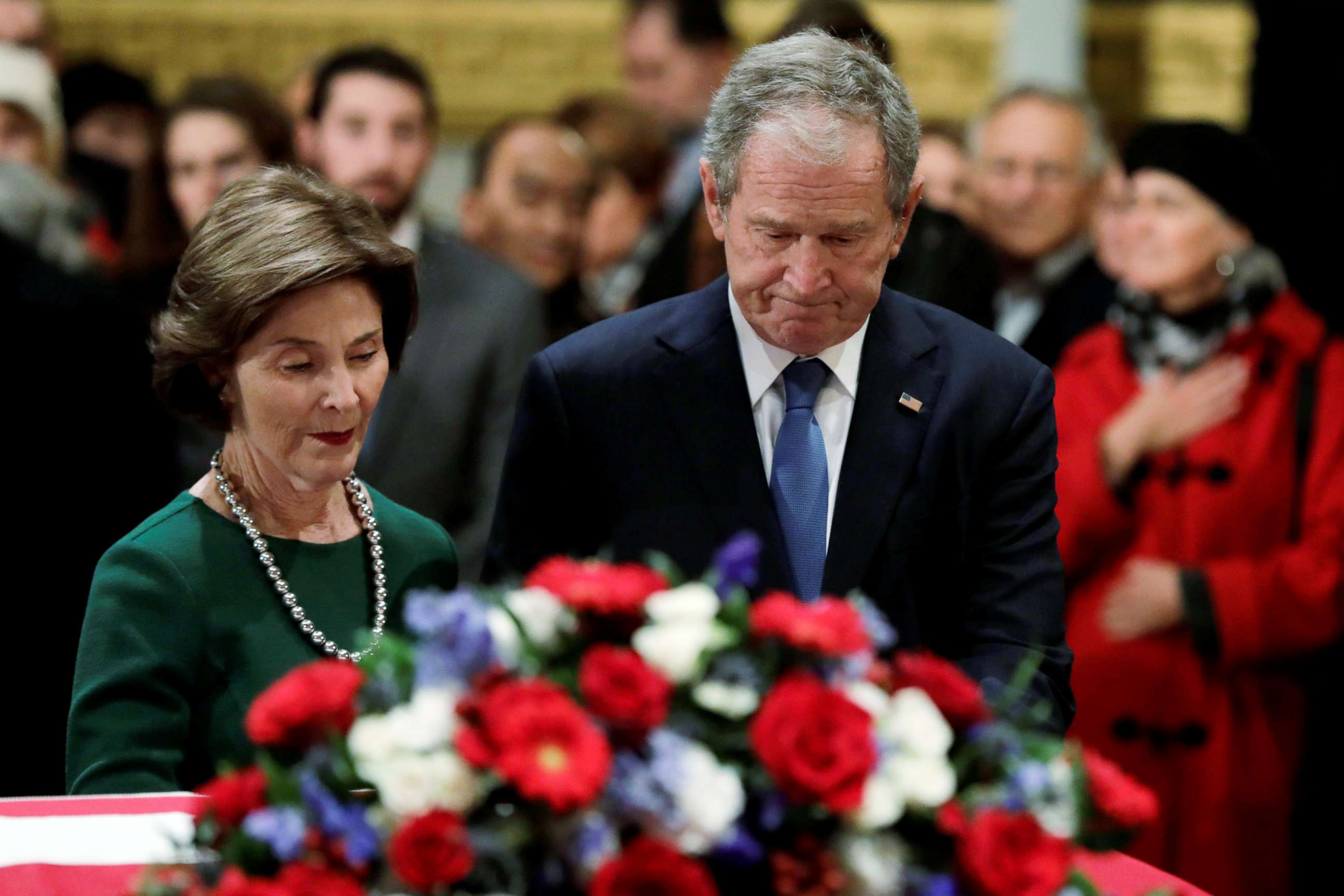 PHOTO: Former President George W. Bush and former First Lady Laura Bush stand at the flag-draped casket of former U.S. President George H.W. Bush as it lies in state inside the U.S. Capitol Rotunda in Washington, Dec. 4, 2018.