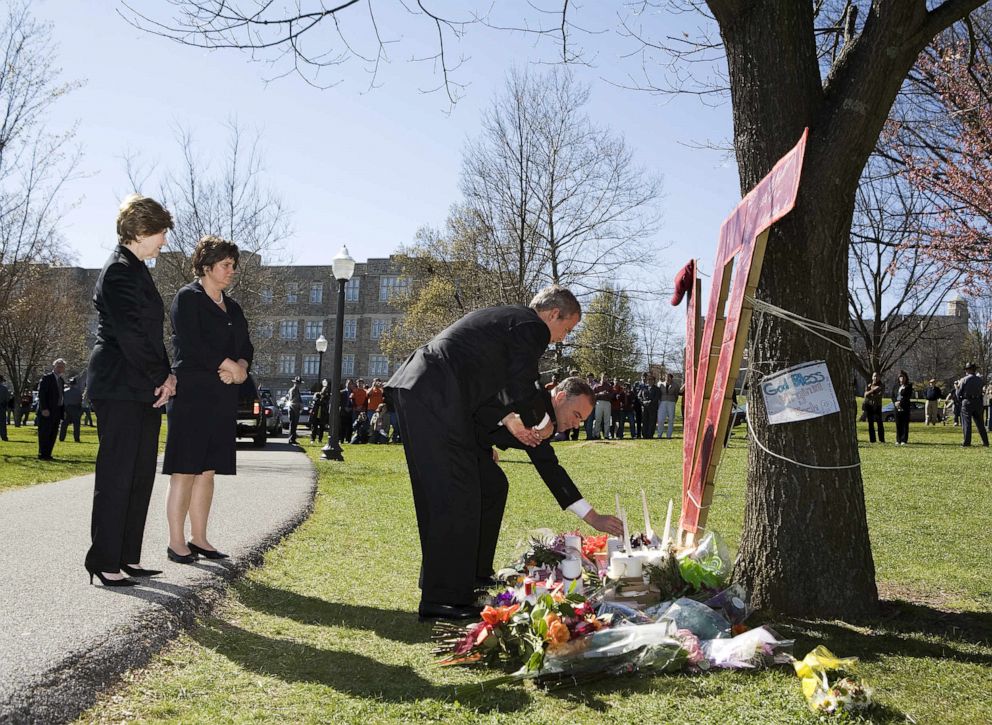 PHOTO: President George W. Bush and  Virginia Governor Timothy M. Kaine pay respects at a makeshift memorial on the campus of Virginia Tech University, April 17, 2007, one day after a shooting massacre at the facility in Blacksburg, Virginia.