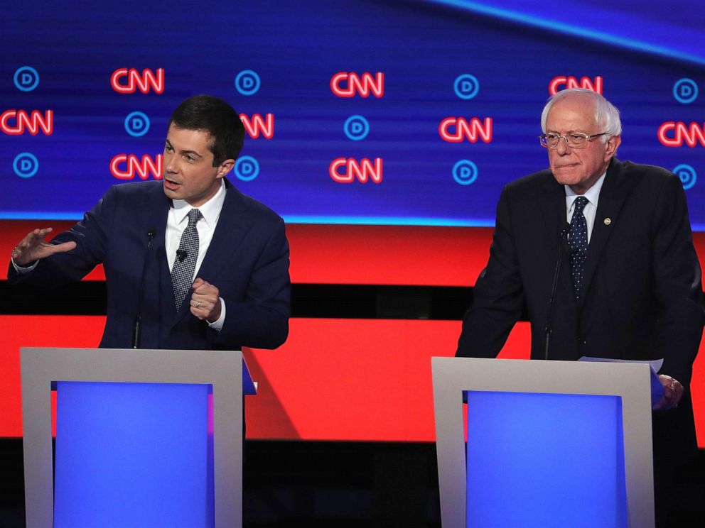 PHOTO: Democratic presidential candidate South Bend, Indiana Mayor Pete Buttigieg (R) speaks while Sen. Bernie Sanders (I-VT) listens during the Democratic Presidential Debate, July 30, 2019, in Detroit.