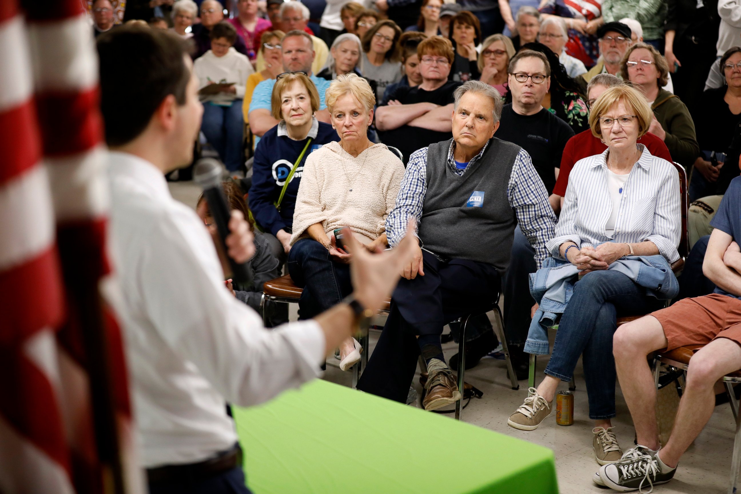 PHOTO: Audience members listen as 2020 Democratic presidential candidate South Bend Mayor Pete Buttigieg speaks during a town hall meeting, Tuesday, April 16, 2019, in Fort Dodge, Iowa.