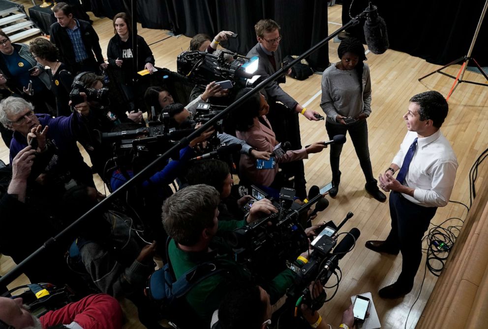 PHOTO: Democratic presidential candidate Pete Buttigieg answers questions from the press at a campaign event at Washington Middle School in Washington, Iowa, Dec. 8, 2019.