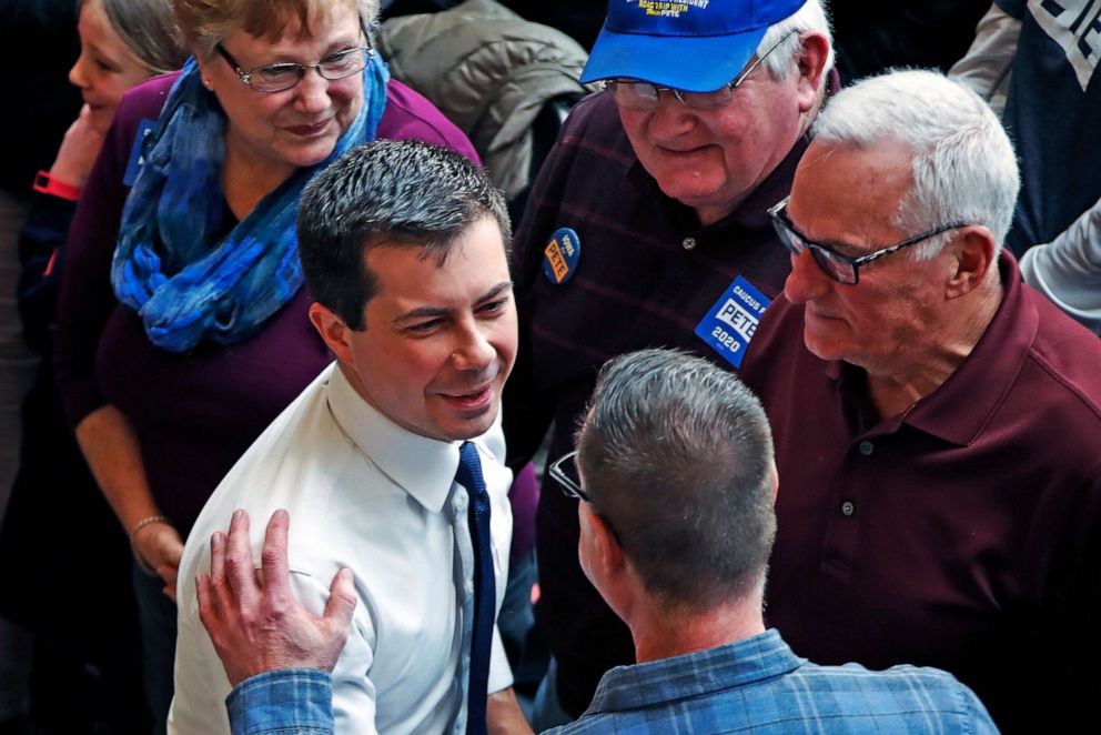 PHOTO: Democratic presidential candidate former South Bend, Ind., Mayor Pete Buttigieg, center, greets supporters following a town hall meeting at the University of Dubuque in Dubuque, Iowa,  Jan. 22, 2020.