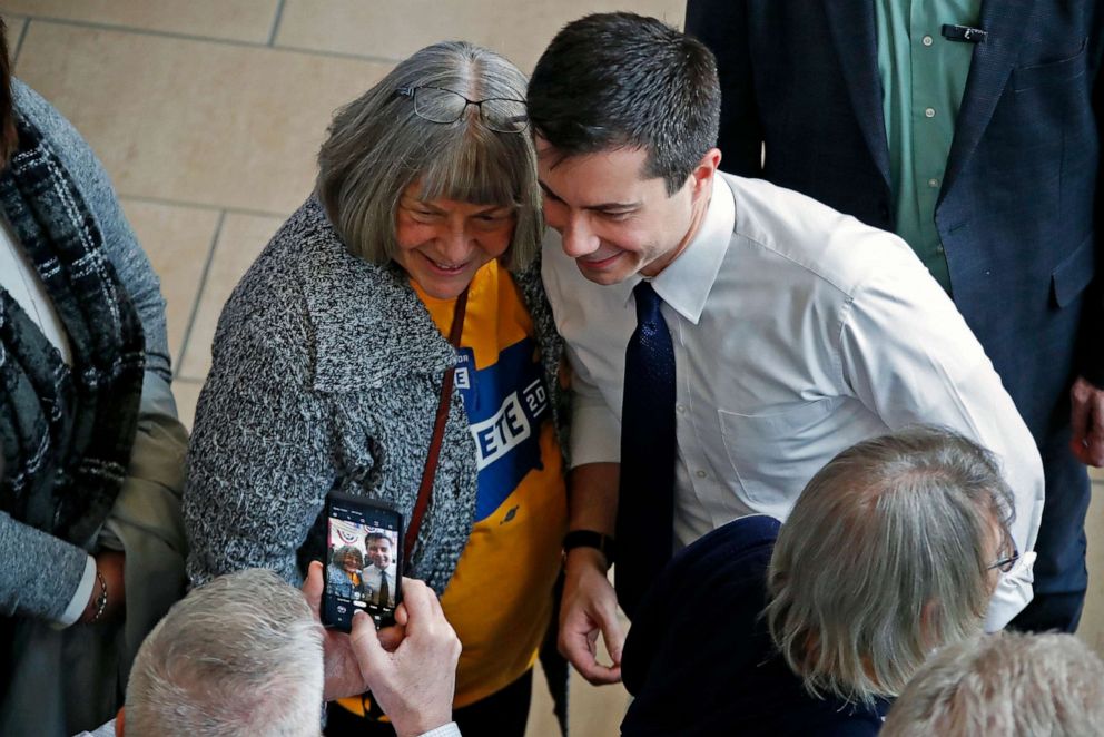 PHOTO: Democratic presidential candidate former South Bend, Ind., Mayor Pete Buttigieg poses for a photo with a supporter following a town hall meeting at the University of Dubuque in Dubuque, Iowa, Jan. 22, 2020.