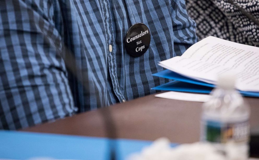 PHOTO: A student wears a button that says: "Counselors Not Cops" at a forum to examine evidence-based violence prevention and school safety measures, on Capitol Hill in Washington, D.C., March 20, 2018. 