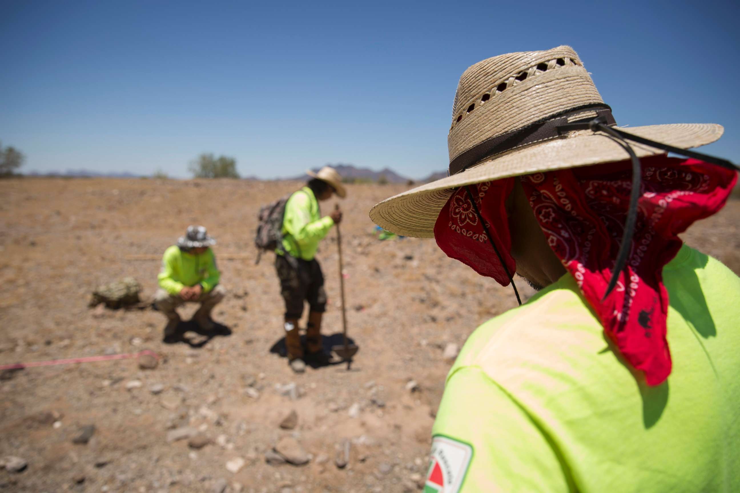 PHOTO: Aguilas del Desierto, Eagkes of the Desert, a search and rescue crew, mark off an area where human remains were found, May 27, 2017, in the Cabeza Prieta wilderness near Ajo, Arizona.
