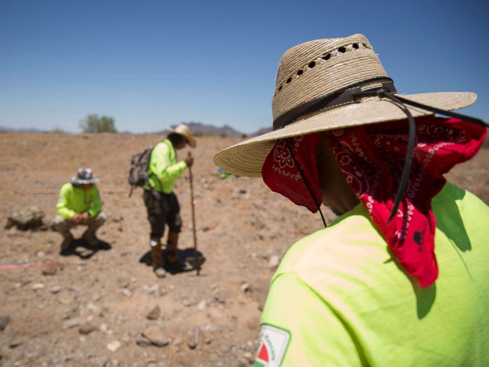 PHOTO: Aguilas del Desierto, Eagkes of the Desert, a search and rescue crew, mark off an area where human remains were found, May 27, 2017, in the Cabeza Prieta wilderness near Ajo, Arizona.