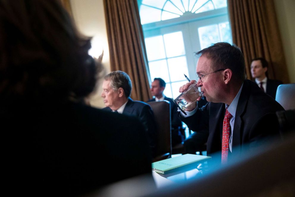 PHOTO: Mick Mulvaney, acting White House chief of staff, takes a drink of water during a cabinet meeting at the White House, Jan. 3, 2019.