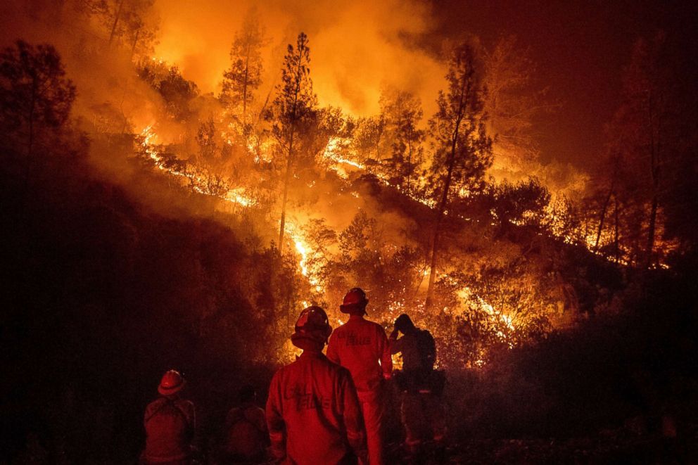 PHOTO: Firefighters monitor a backfire while battling the Ranch Fire, part of the Mendocino complex fire, Aug. 7, 2018, near Ladoga, Calif.