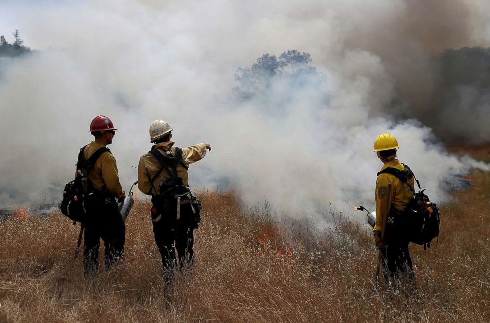 PHOTO: Firefighters monitor a controlled burn at Bouverie Preserve, May 30, 2017 in Glen Ellen, Calif. 