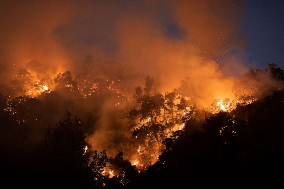 PHOTO: The Bobcat Fire burns near homes, Sept. 13, 2020, in Arcadia, California.