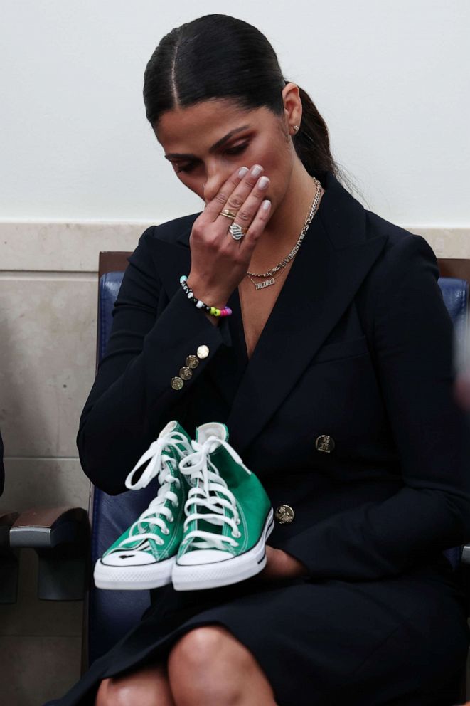 PHOTO: Camila Alves McConaughey, wife of actor Matthew McConaughey, holds a pair of shoes worn by one of the victims of the school shooting in Uvalde, Texas, during the daily news conference at the White House on June 07, 2022 in Washington, DC.