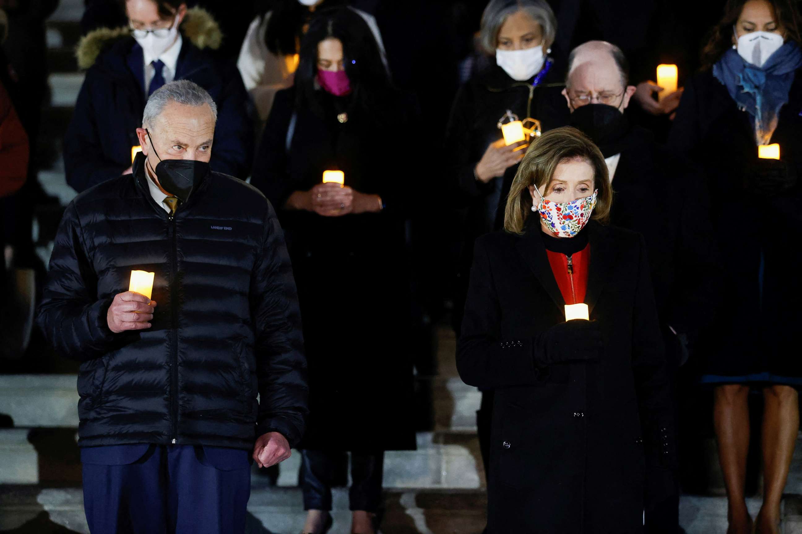 PHOTO: House Speaker Nancy Pelosi, Senate Majority Leader Chuck Schumer and members of Congress participate in a prayer vigil on the East steps of the Capitol, Jan. 6, 2022.