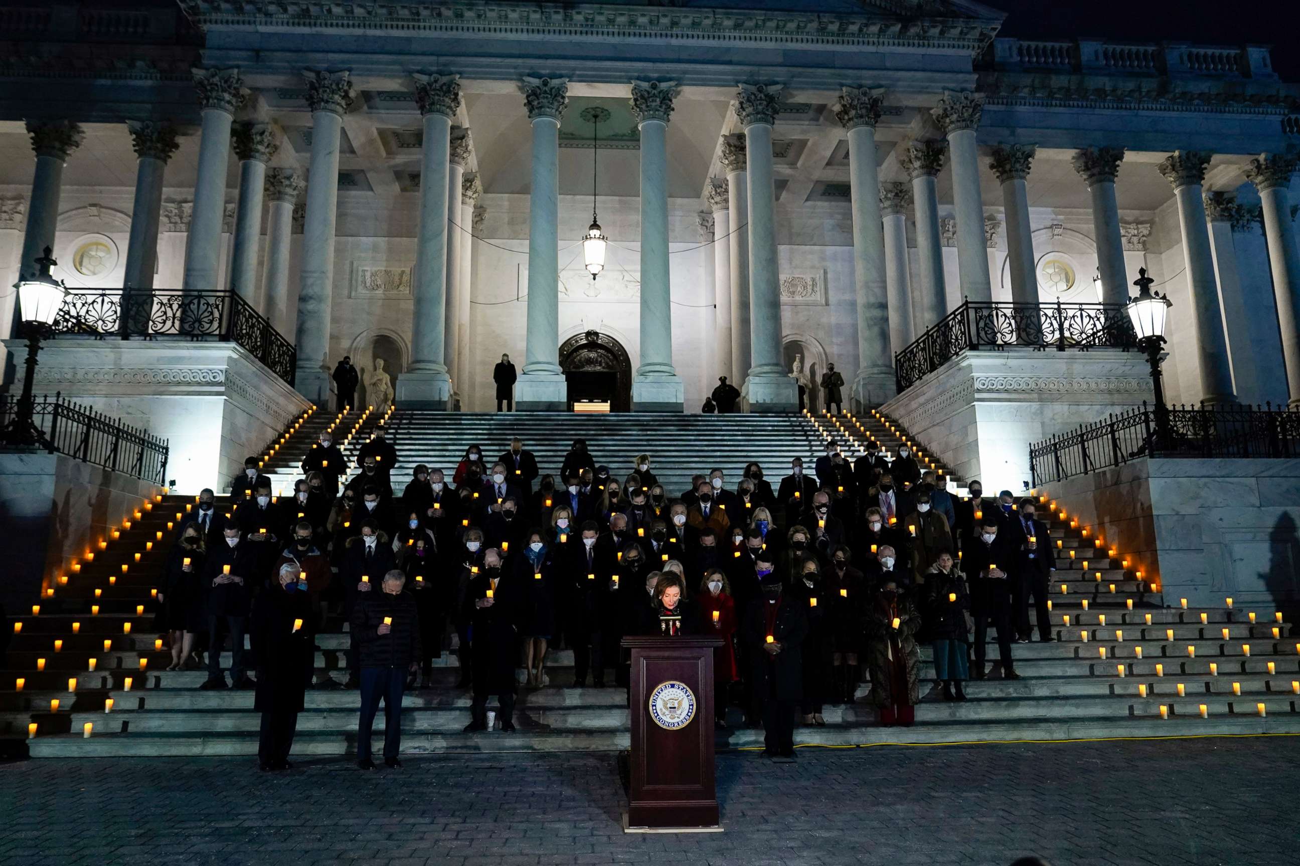 PHOTO: House Speaker Nancy Pelosi speaks as members of the House and Senate participate in a prayer vigil on the East Steps of the Capitol, Jan. 6, 2022,