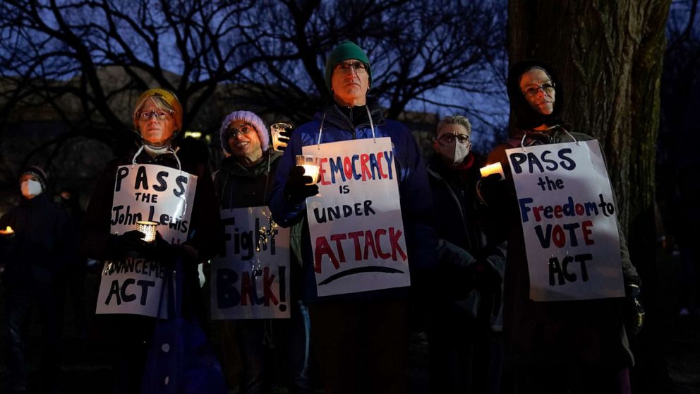 PHOTO: People attend a candlelight vigil outside the Capitol building, Jan. 6, 2022, on the one year anniversary of the attack on the Capitol. 