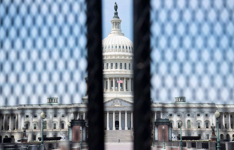 PHOTO: A tall security fence surrounds the US Capitol ahead of President Joe Biden's address to a joint session of Congress in Washington, D.C, April 28, 2021. 