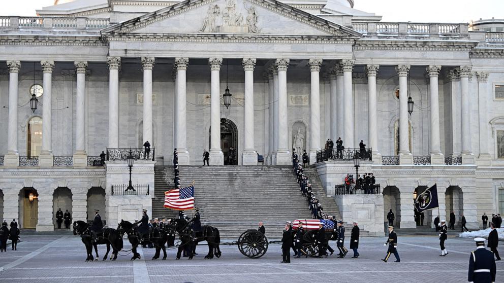 PHOTO: The flag-draped casket of former President Jimmy Carter travelling by a horse-drawn caisson arrives to the US Capitol to lie in state in Washington, DC, on January 7, 2025.